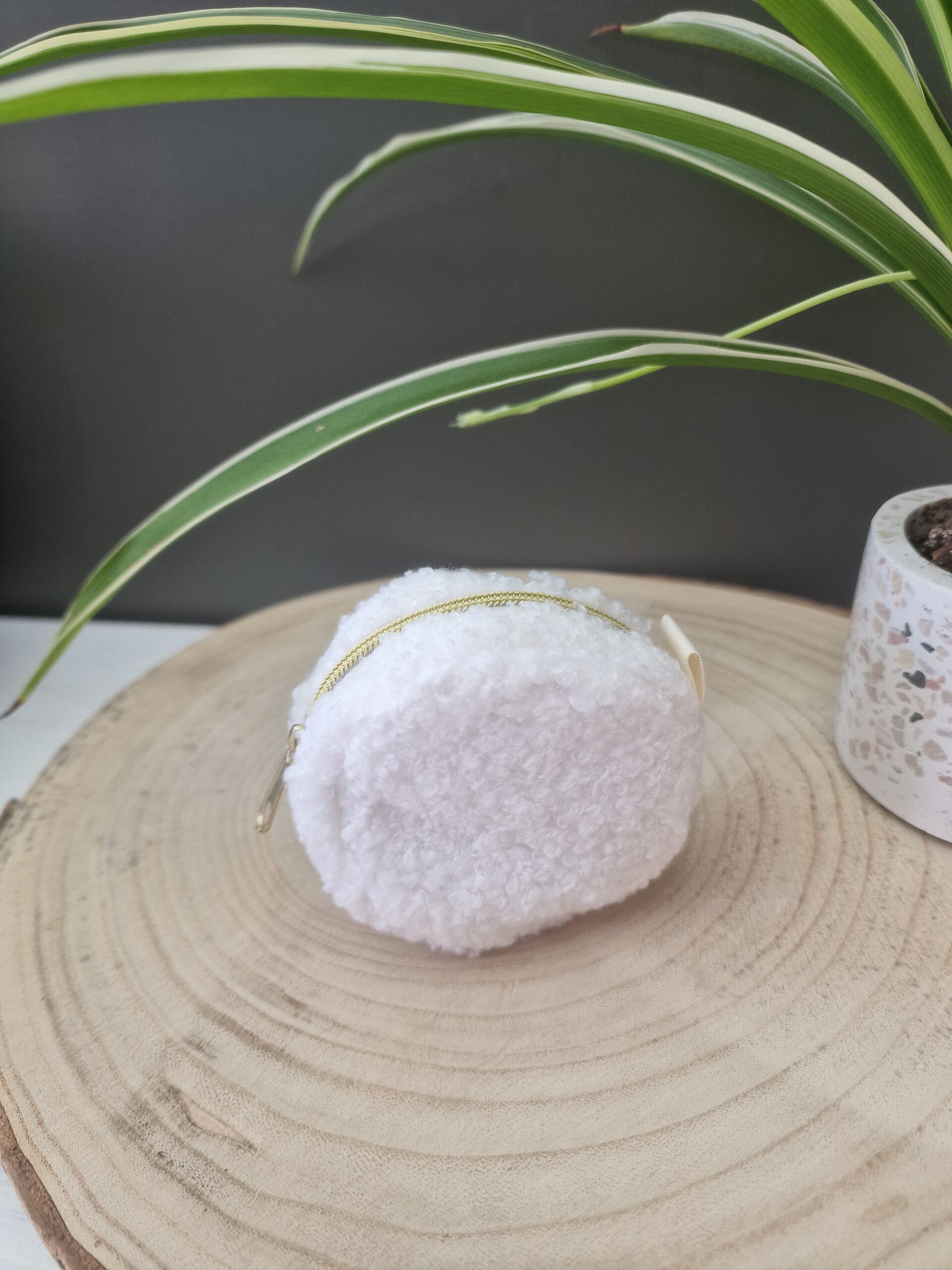 Bouclé wit met rits